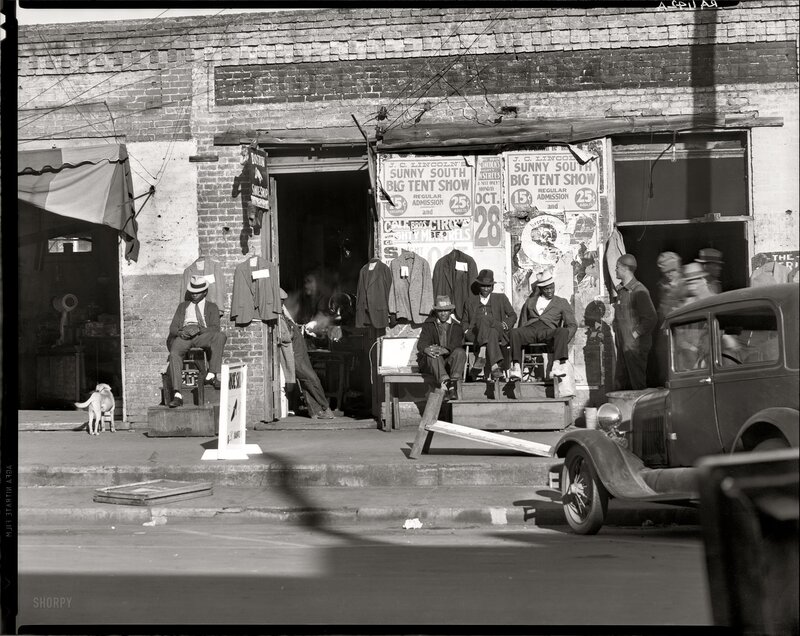 Men outside a storefront in the 1930s