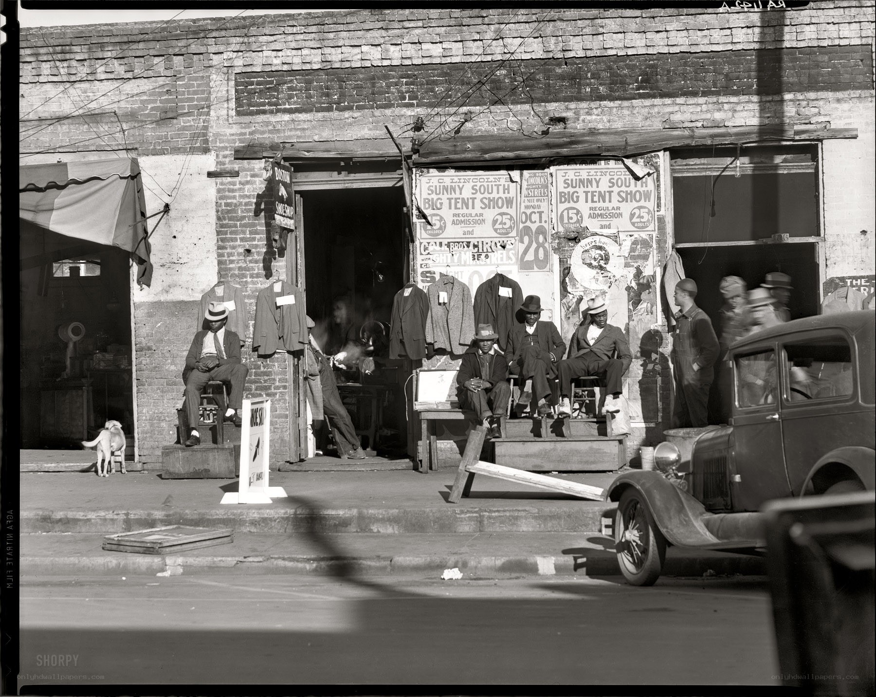 Men outside a storefront in the 1930s