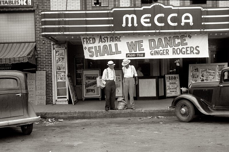Men outside Mecca theater
