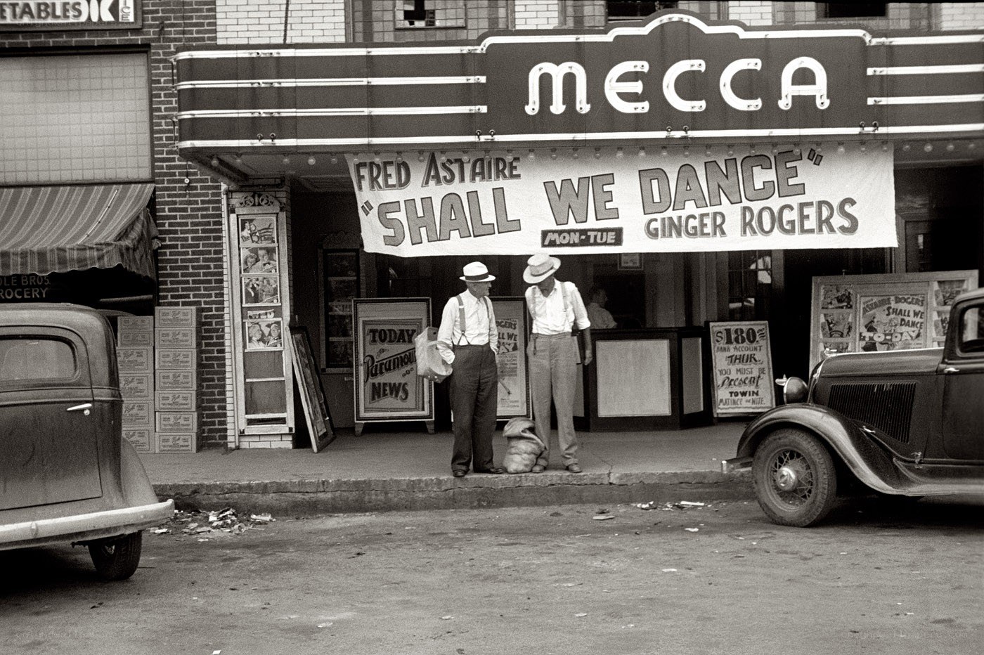 Men outside Mecca theater