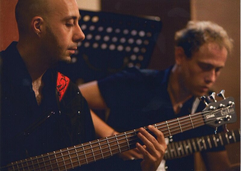 Men Playing Bass Guitars