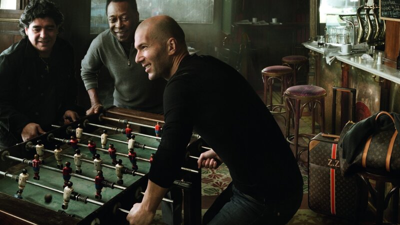 Men playing foosball in a bar