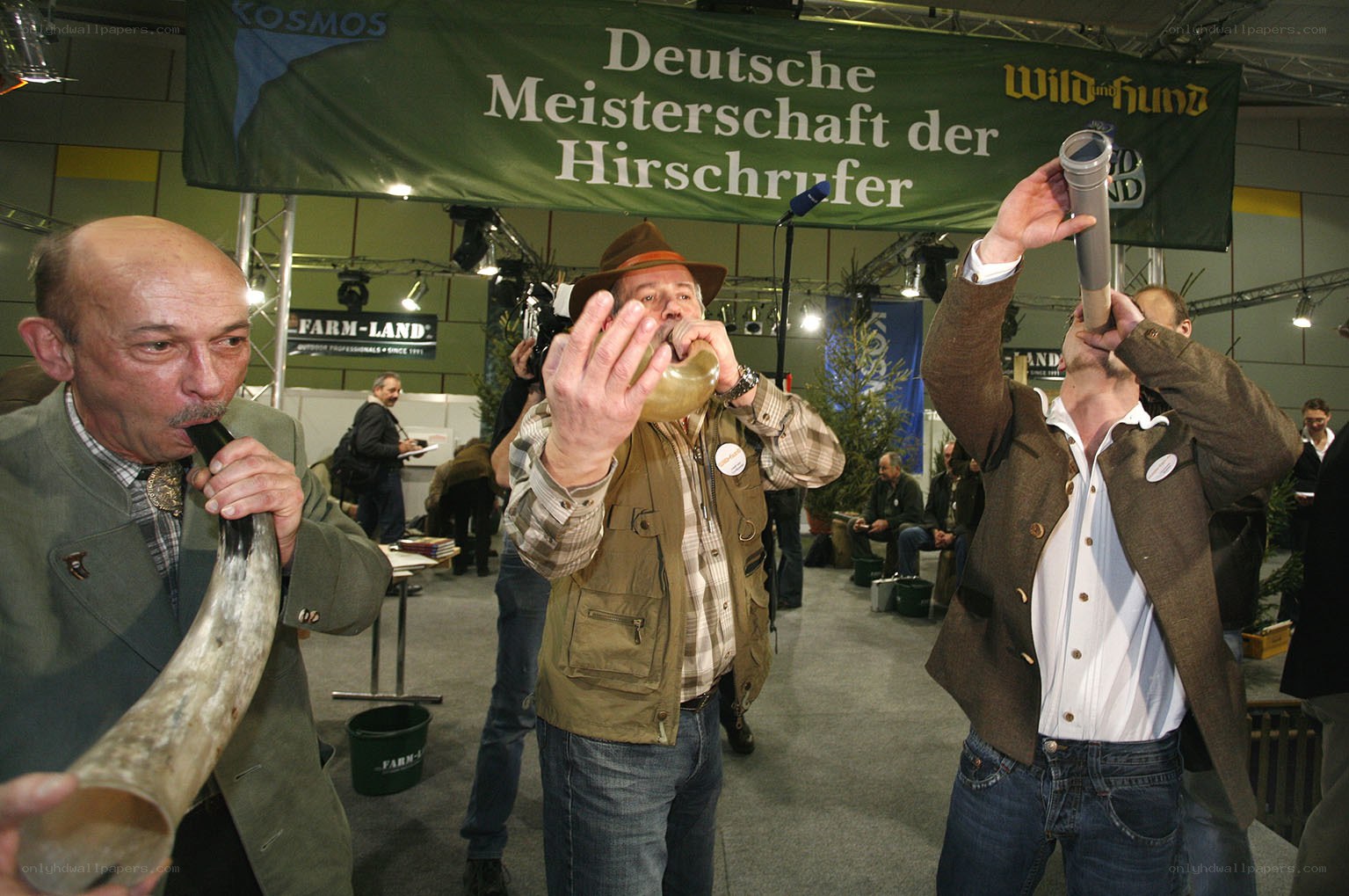Men playing horns at competition