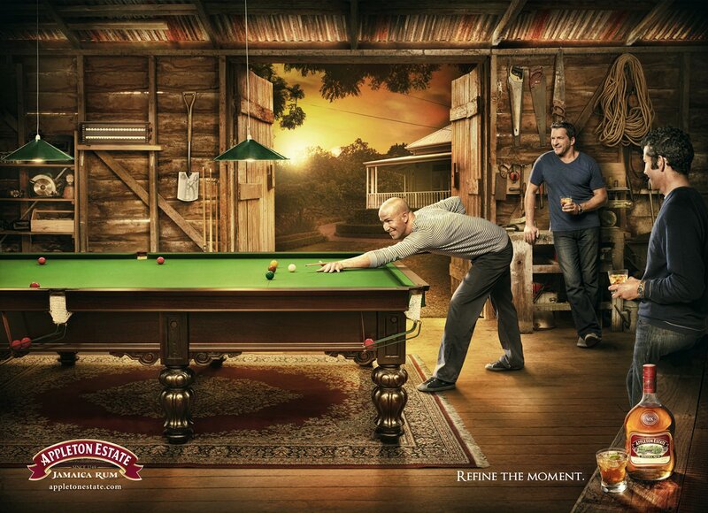 Men playing pool in a rustic shed