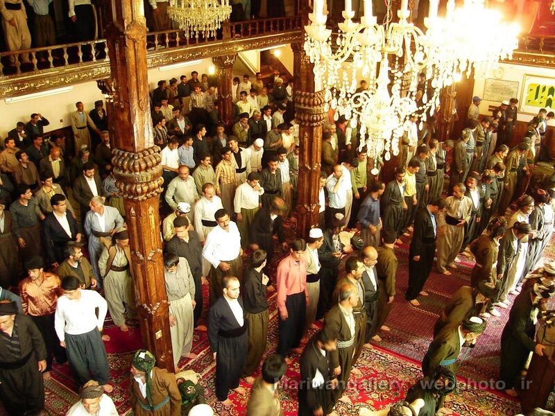 Men praying in a mosque