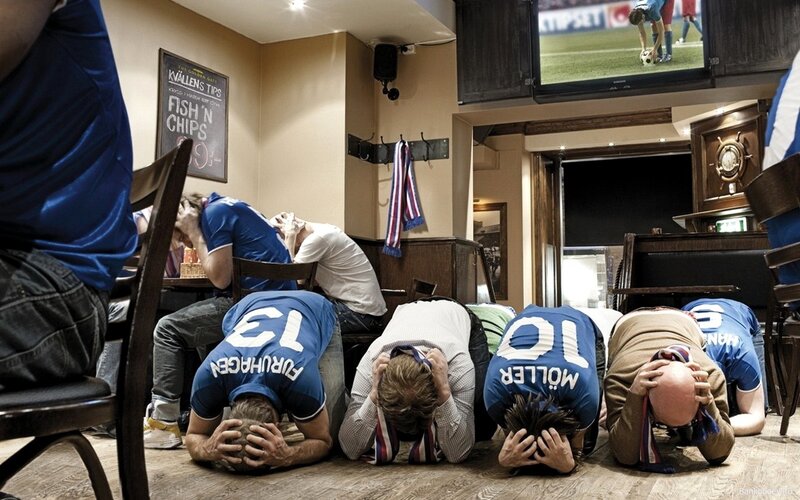 Men Praying in Pub
