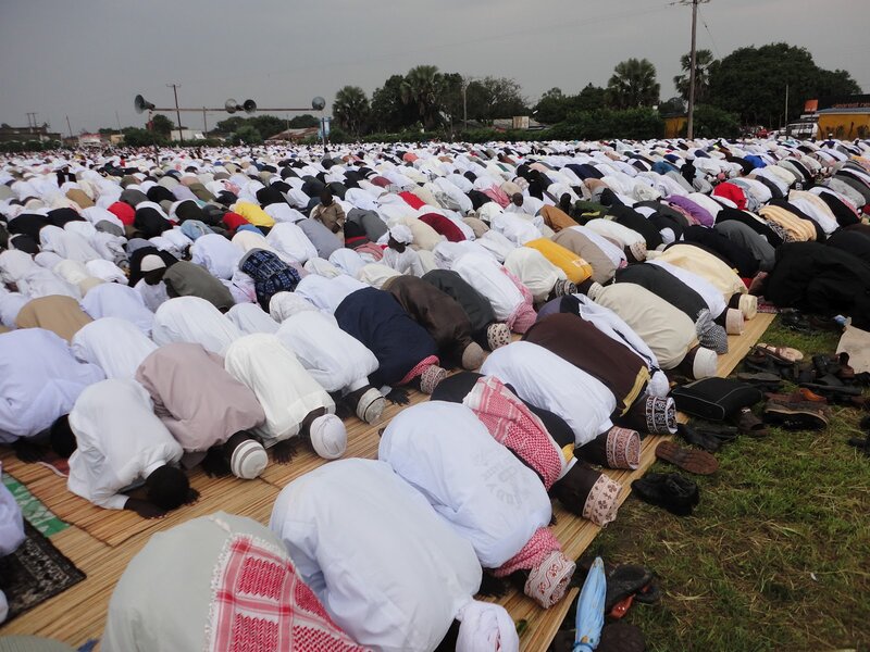 Men Praying in Unison