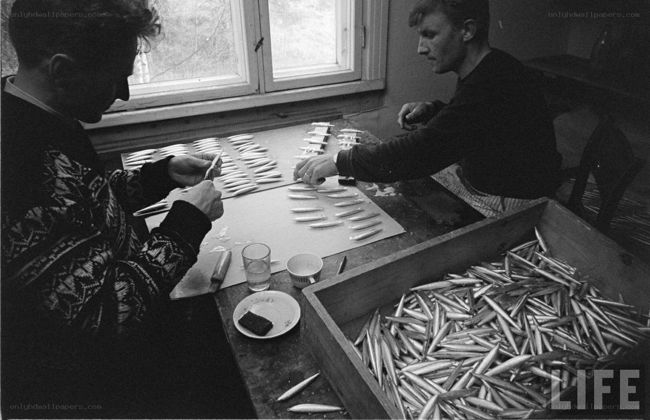 Men preparing fishing lures