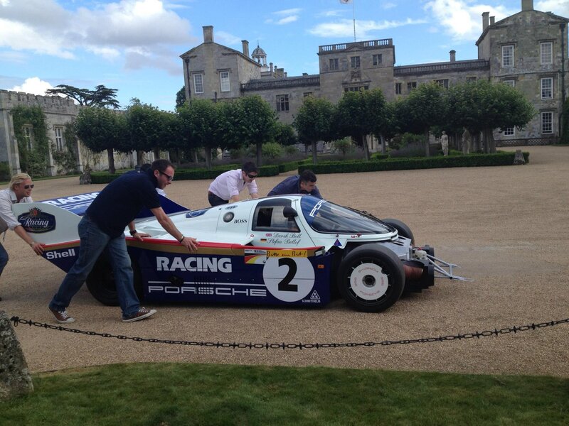 Men Pushing a Race Car — Blue