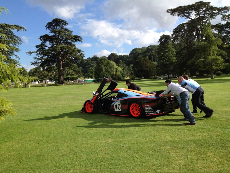 Men Pushing Race Car
