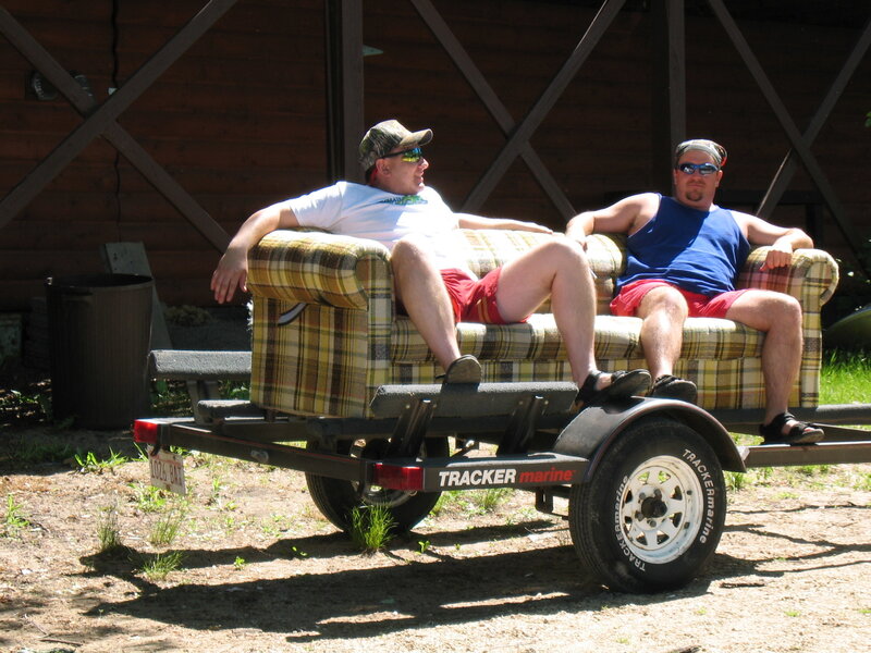Men relaxing on a couch trailer