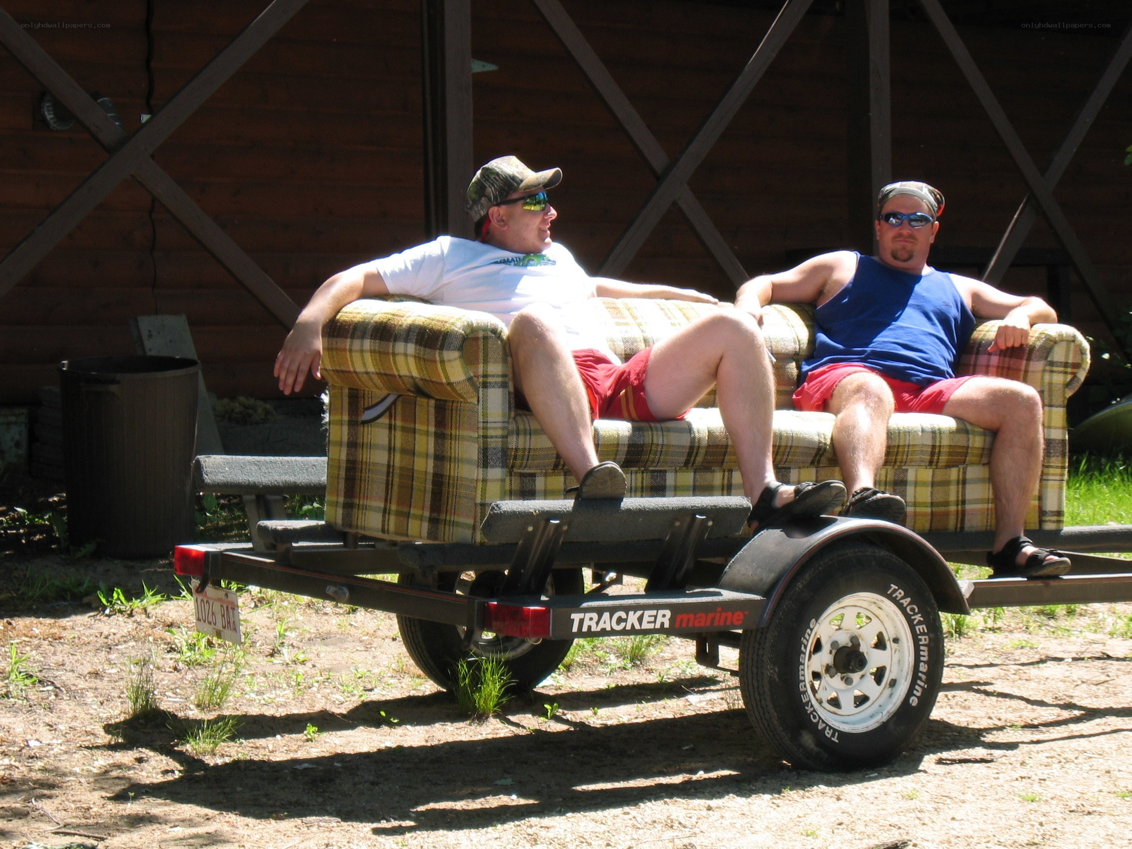 Men relaxing on a couch trailer