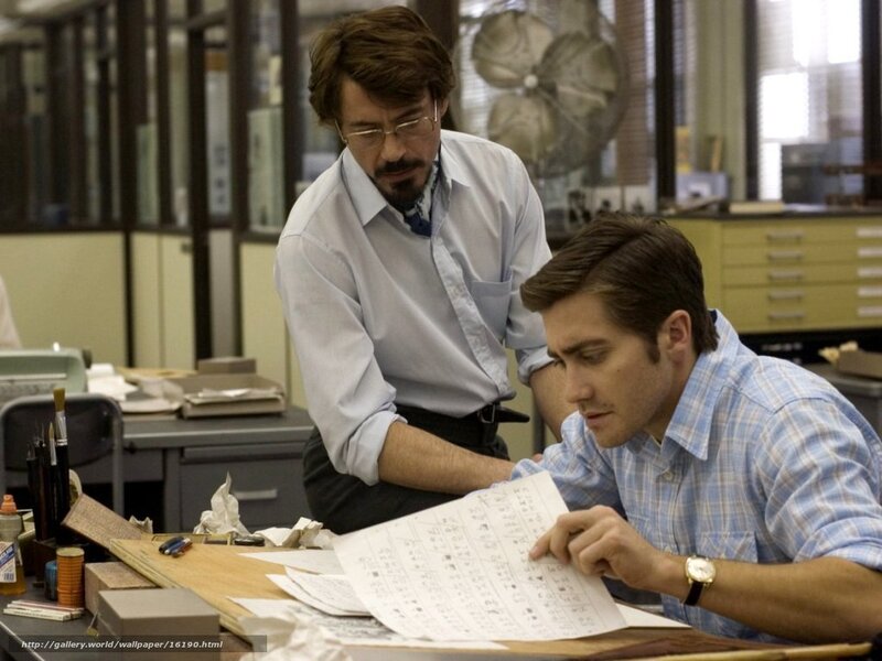 Men reviewing documents at desk