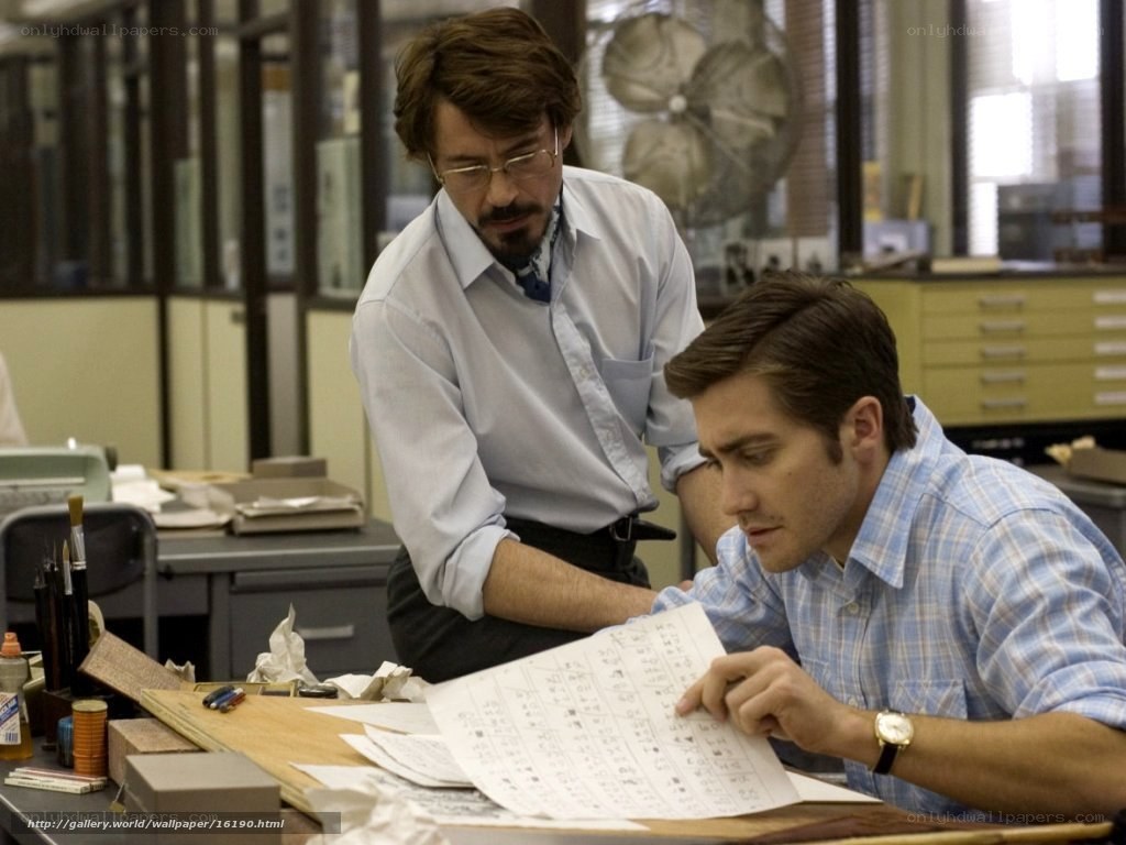 Men reviewing documents at desk