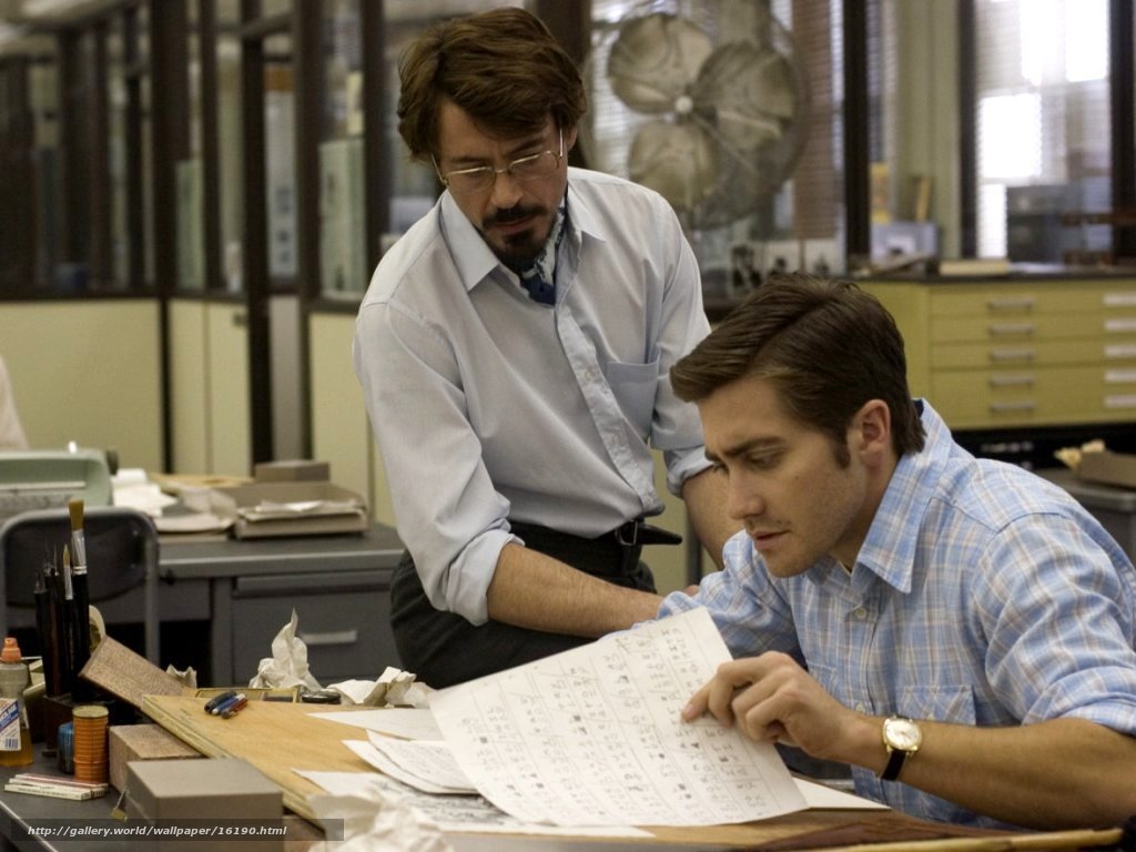 Men reviewing documents at desk