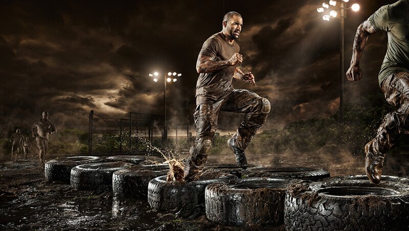 Men Running Through Mud
