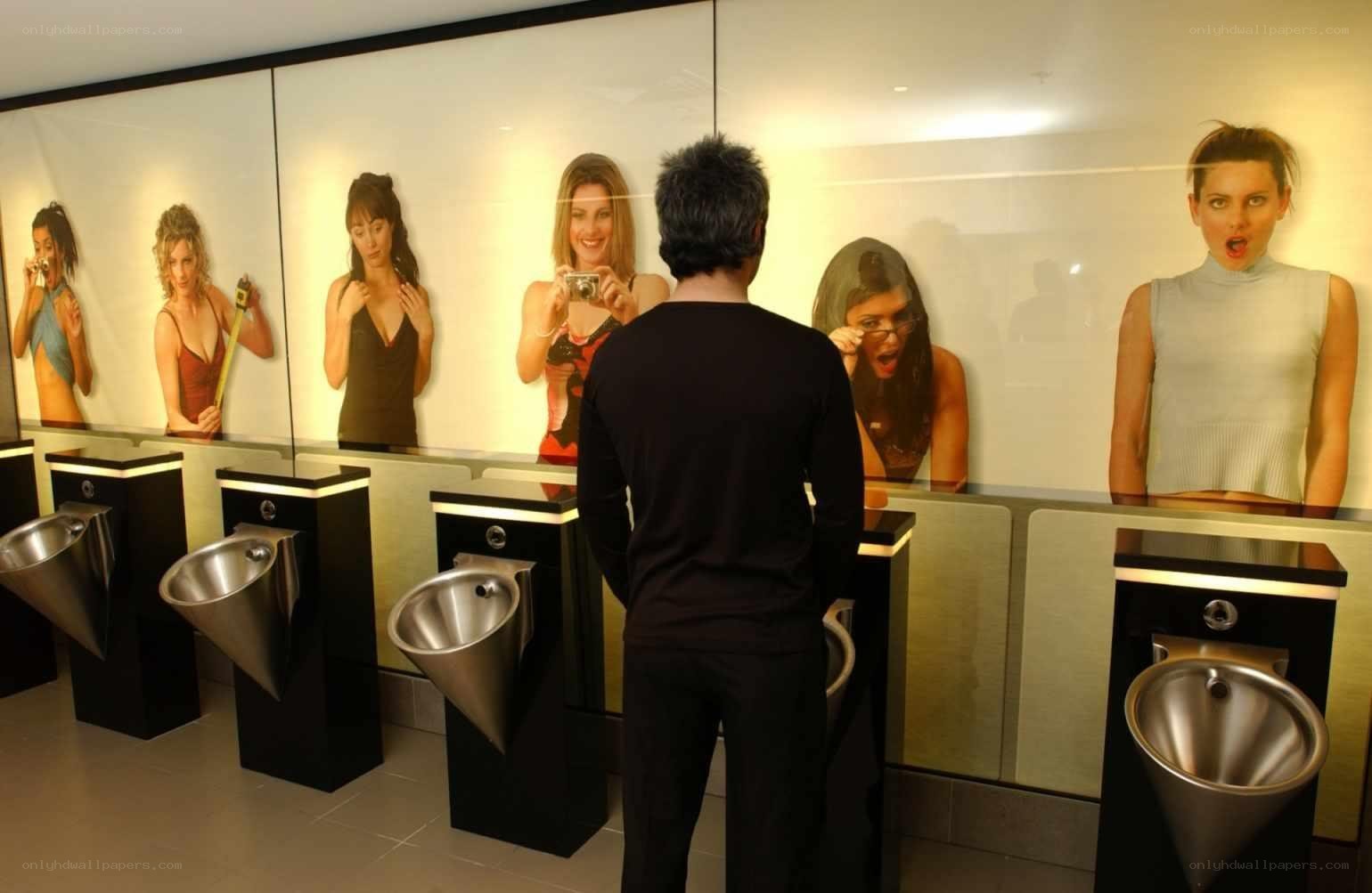 men's restroom with art installations