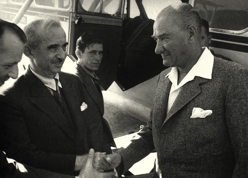 Men shaking hands at airport