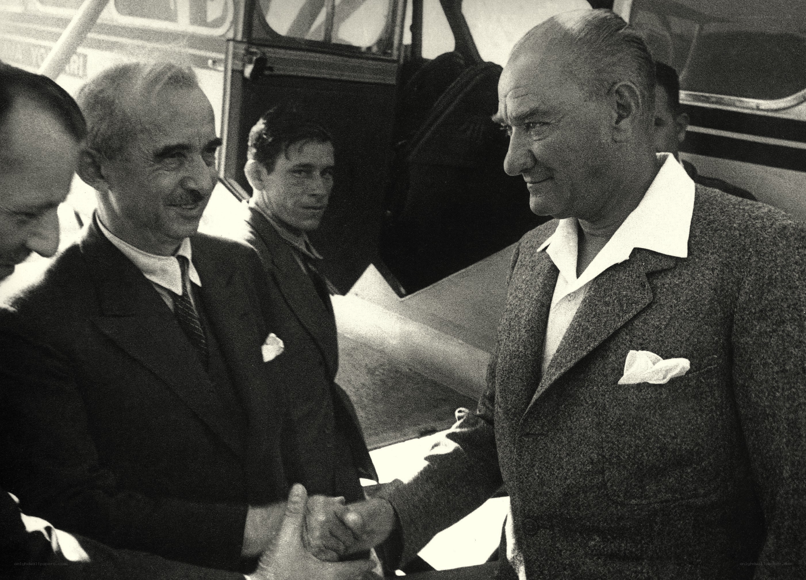 Men shaking hands at airport