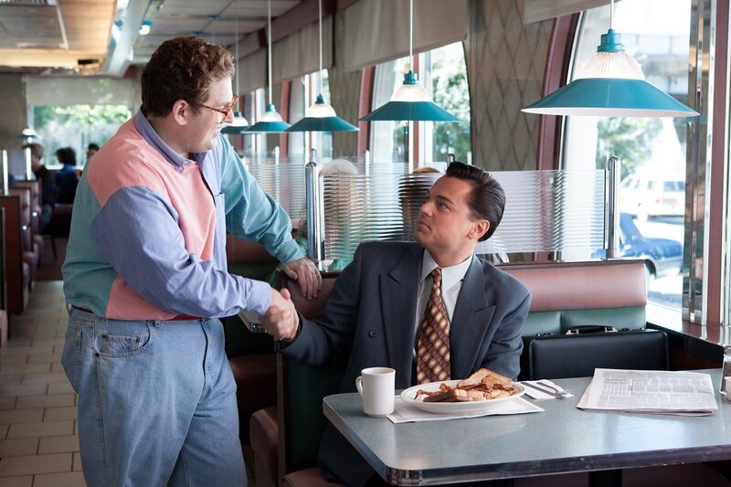 Men shaking hands in a diner