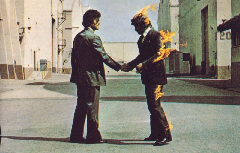 Men Shaking Hands on Fire