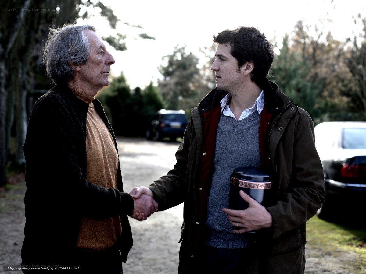 men shaking hands outdoors