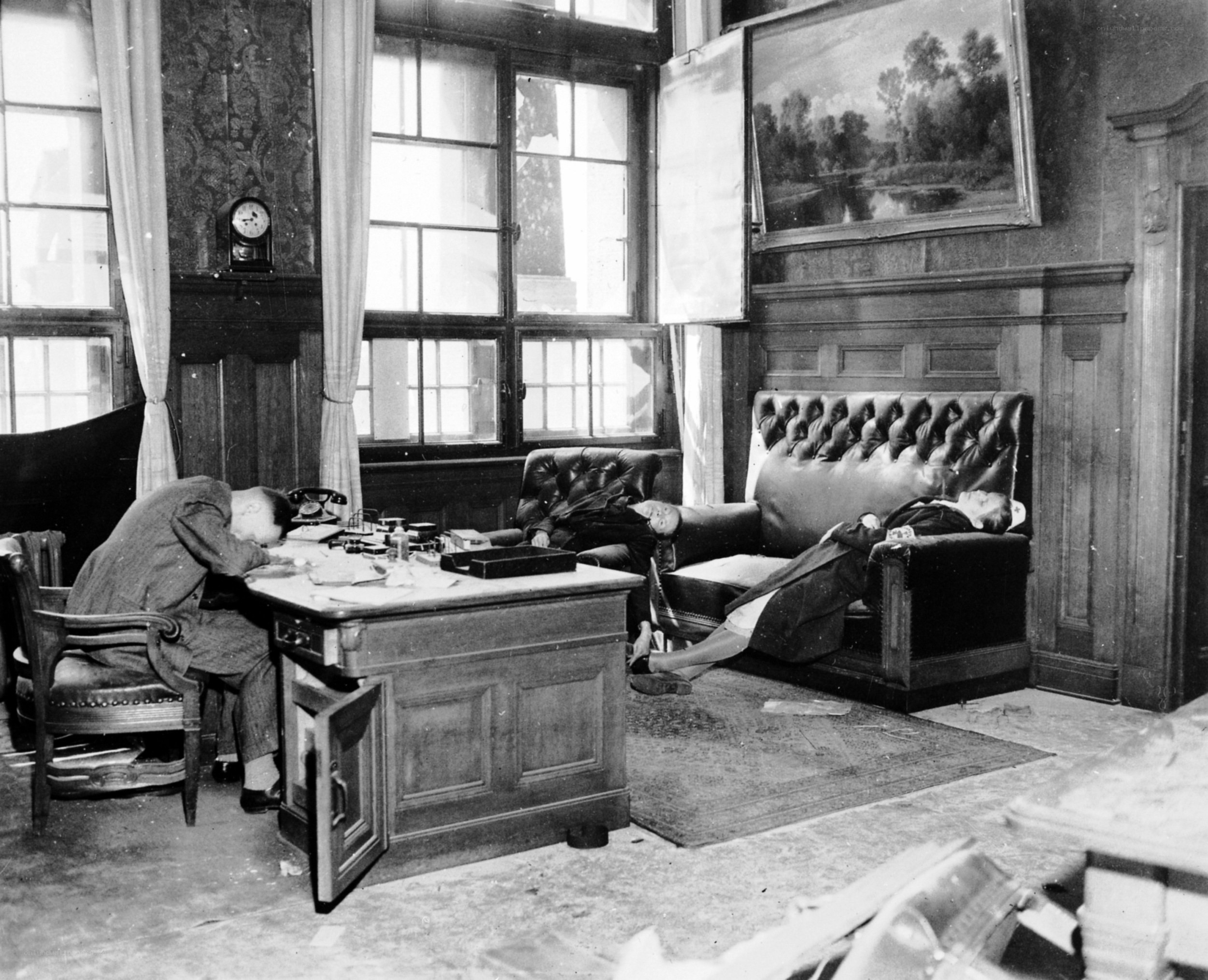 Men sleeping in an office