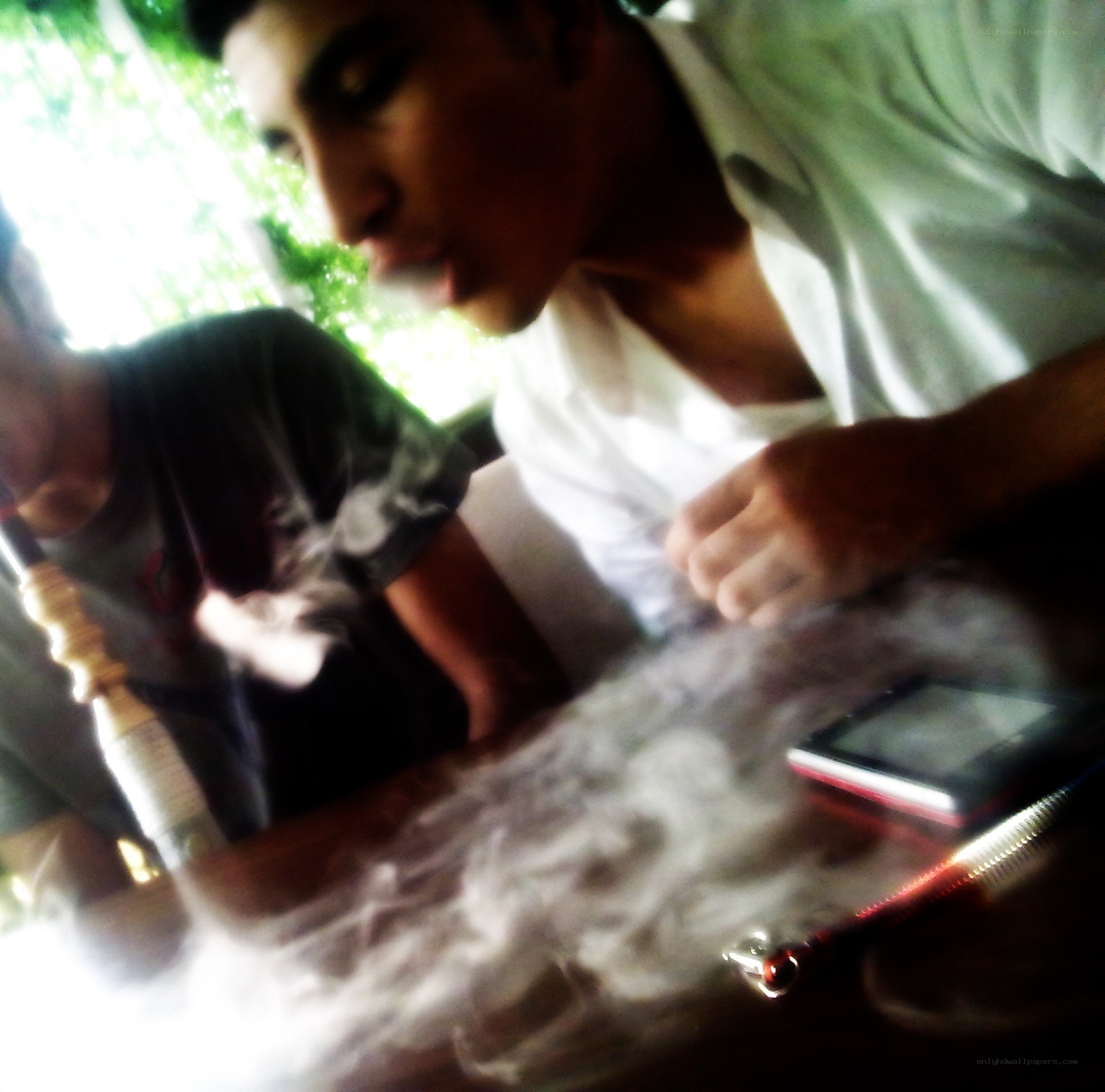 men smoking hookah at table