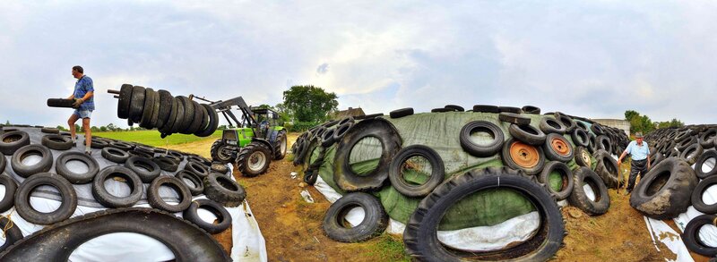 Men Stacking Tires