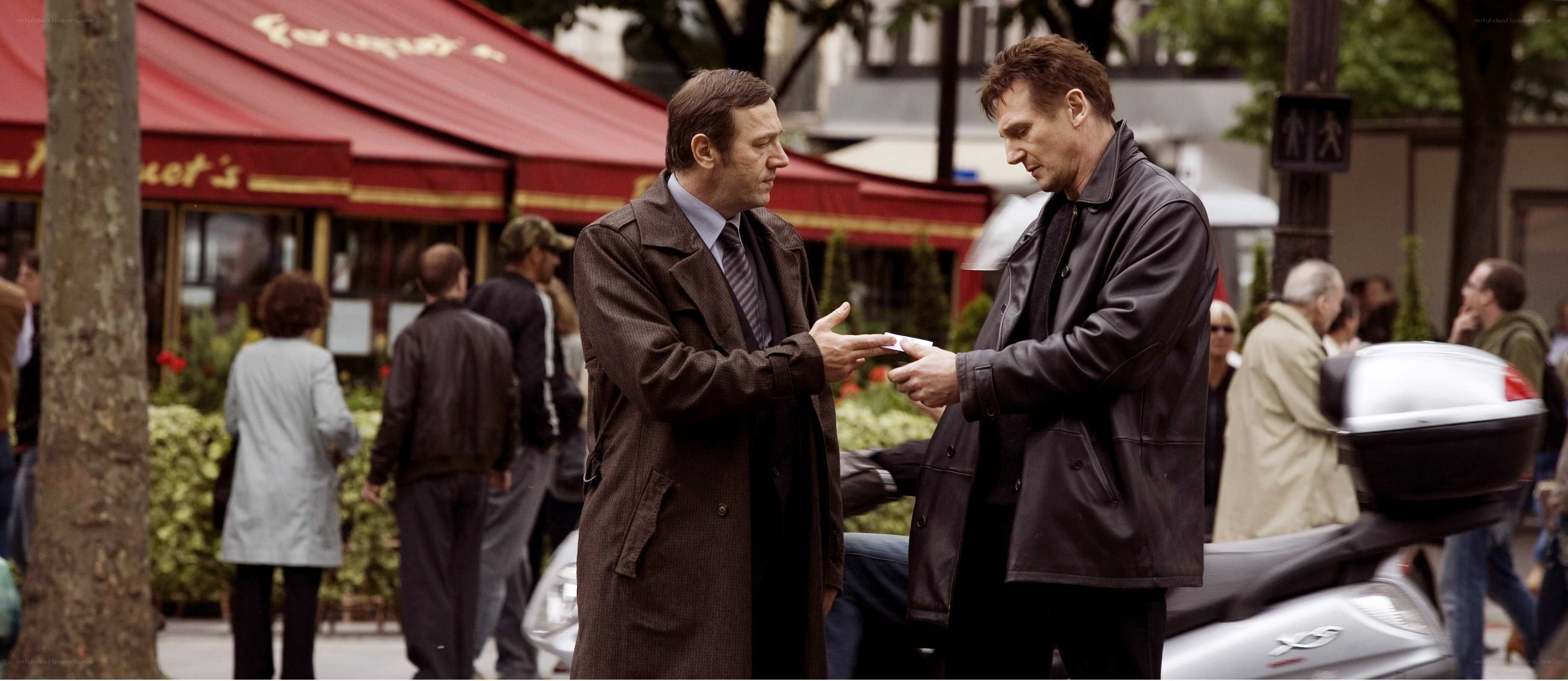 Men talking on a city street