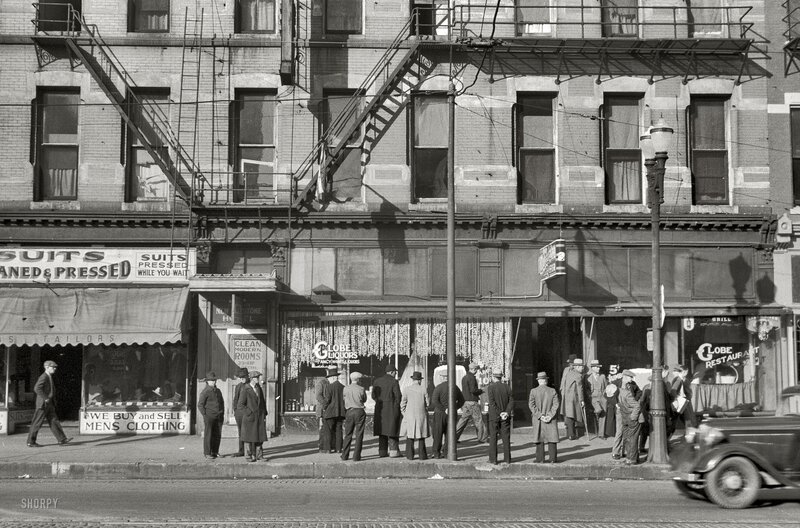 Men waiting on a city street