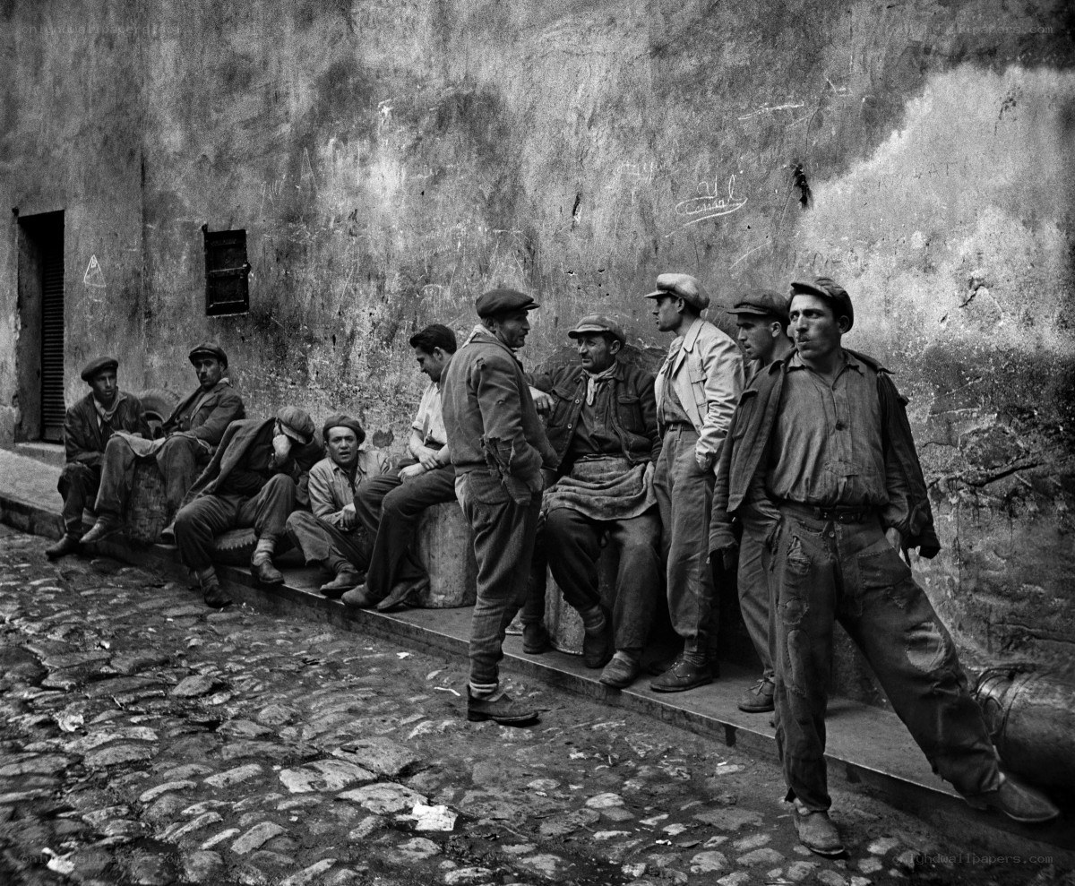 Men waiting on a street