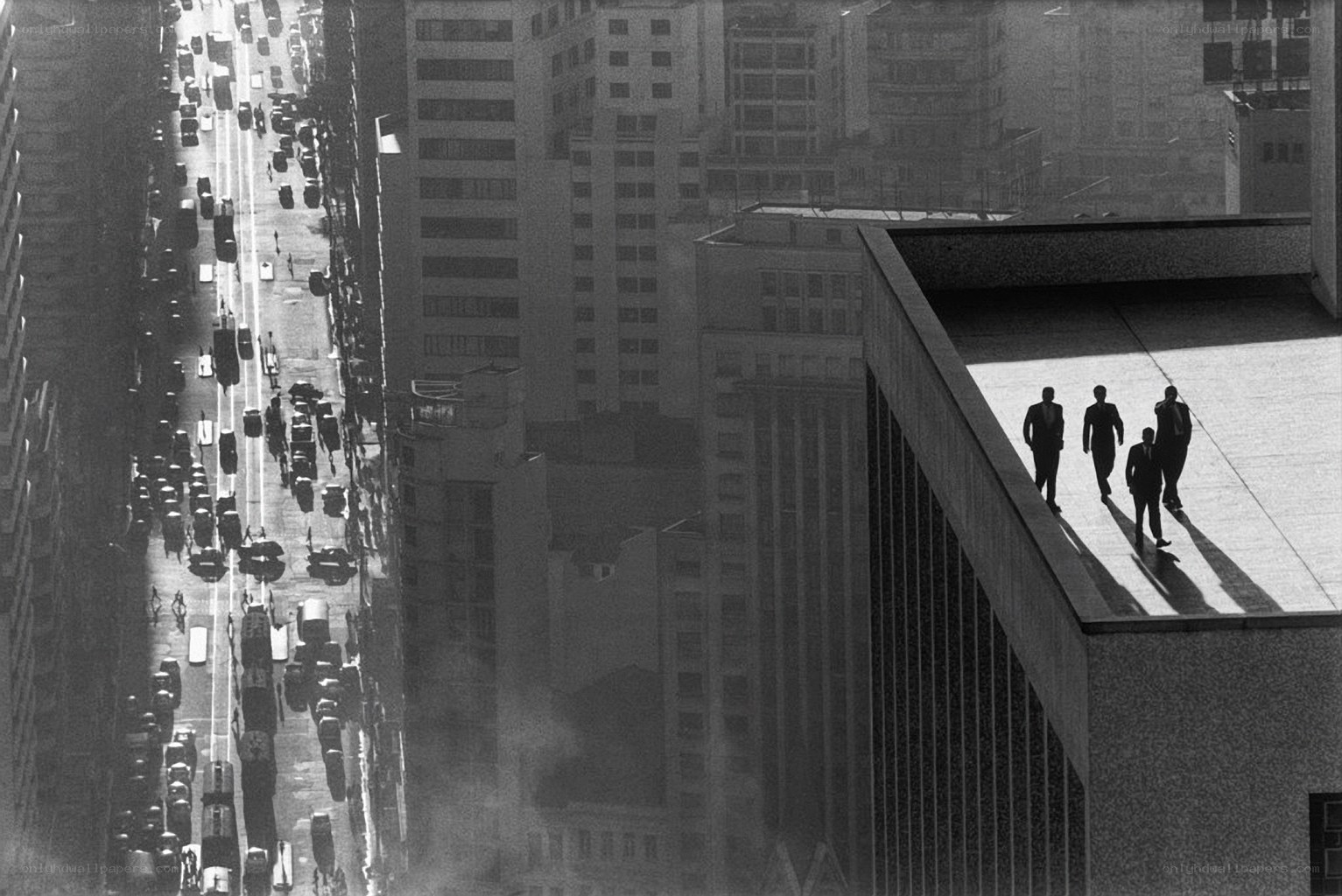 Men walking on rooftop