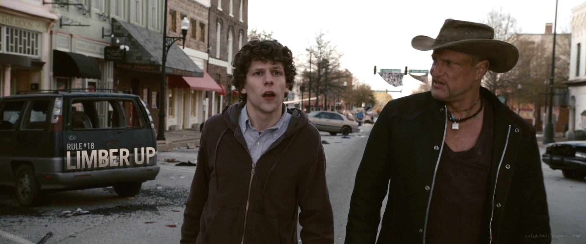 Men walking through town aftermath
