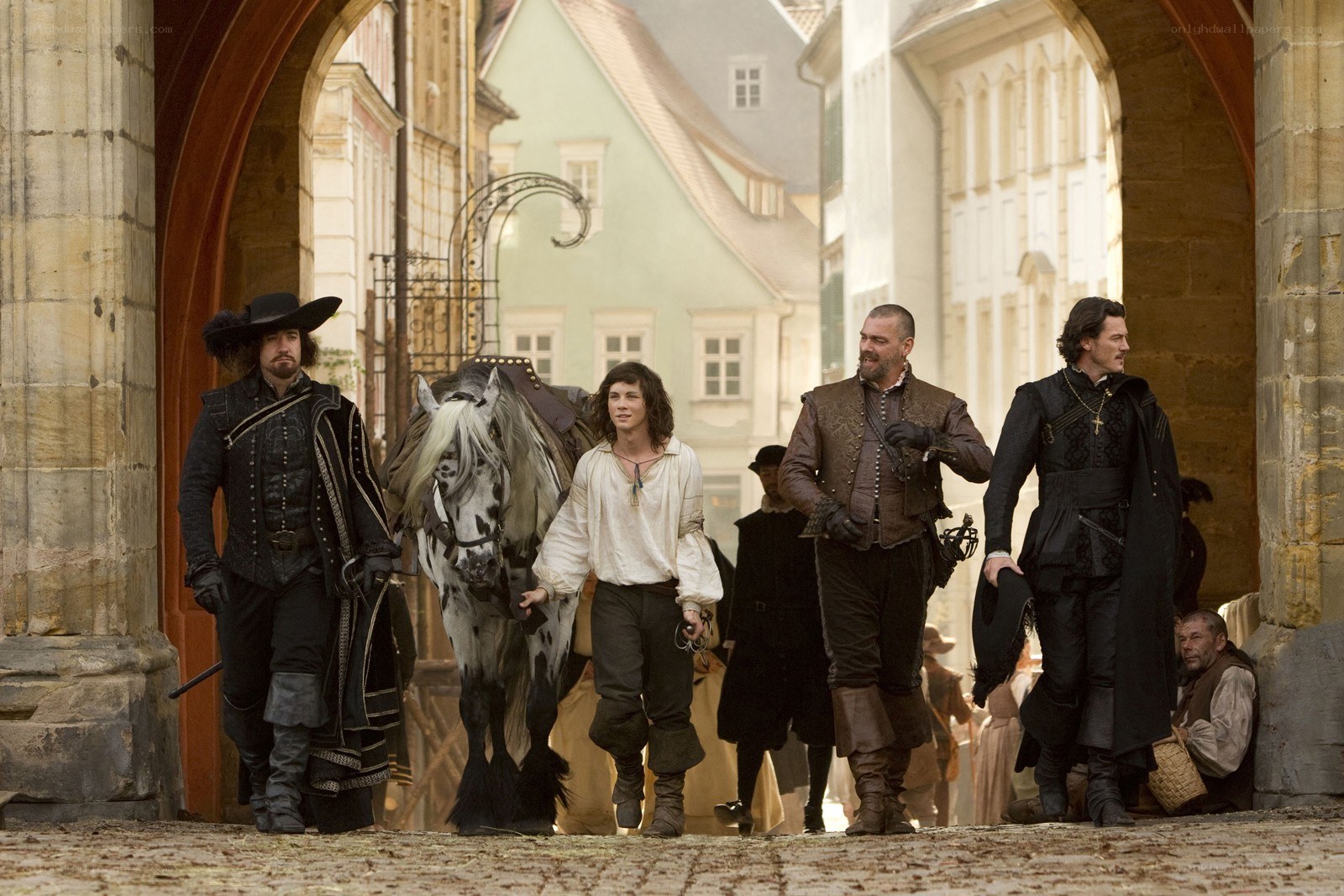 Men walking through town with horse
