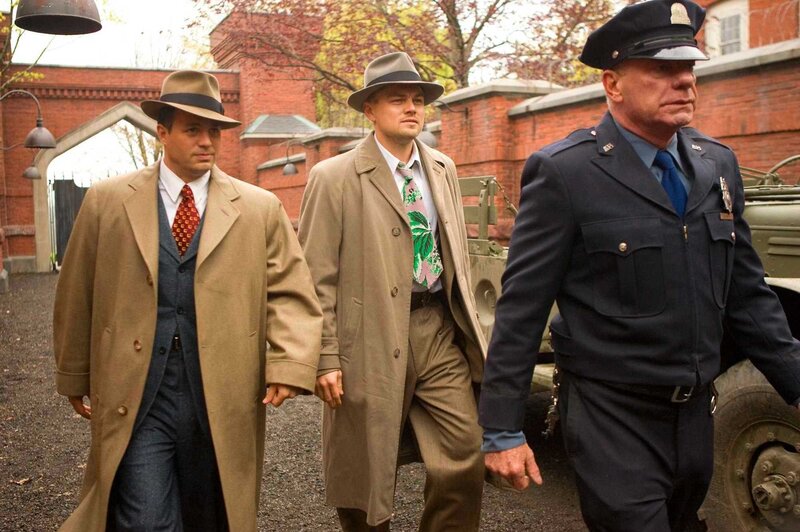 Men walking with police officer