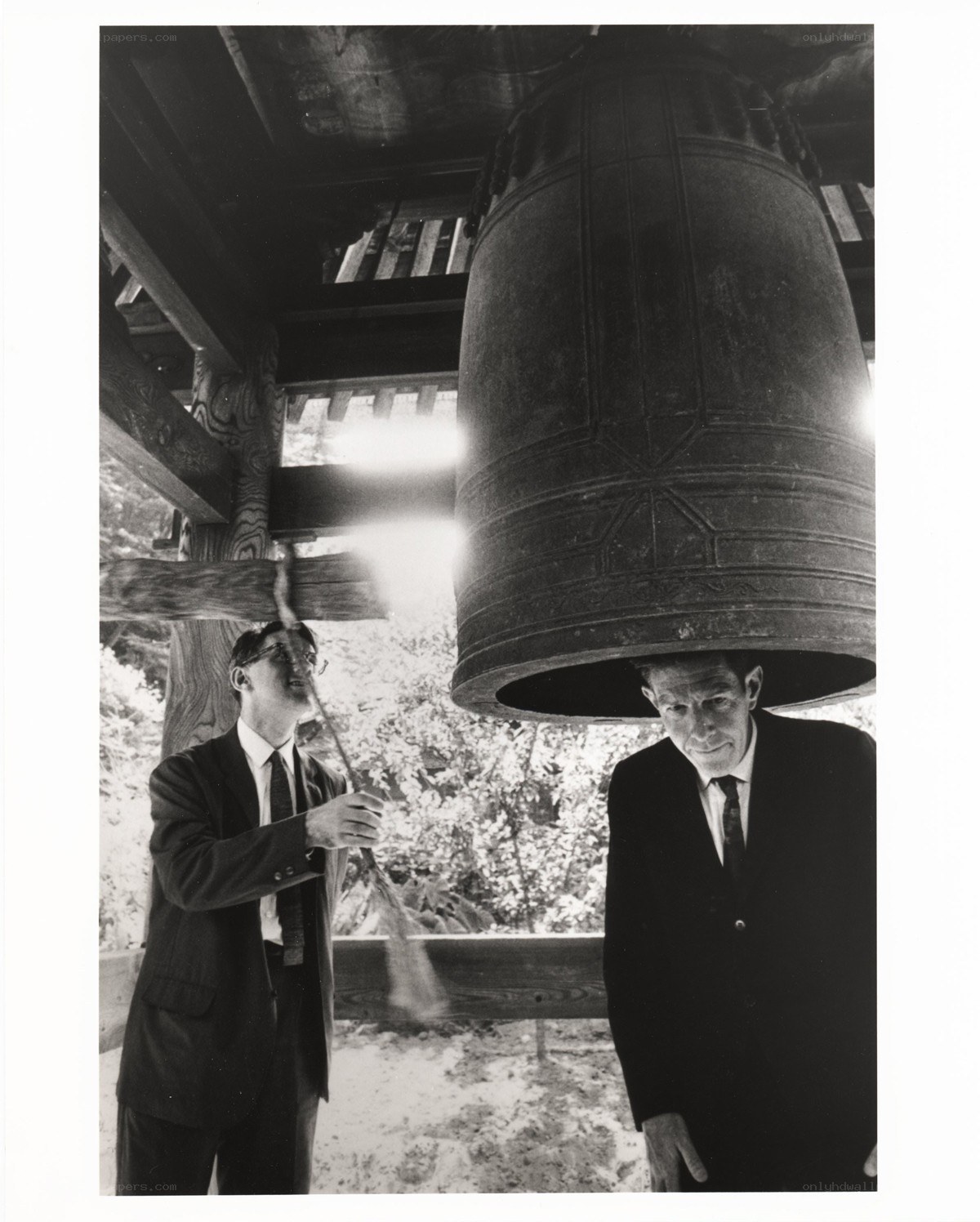 Men with a large bell