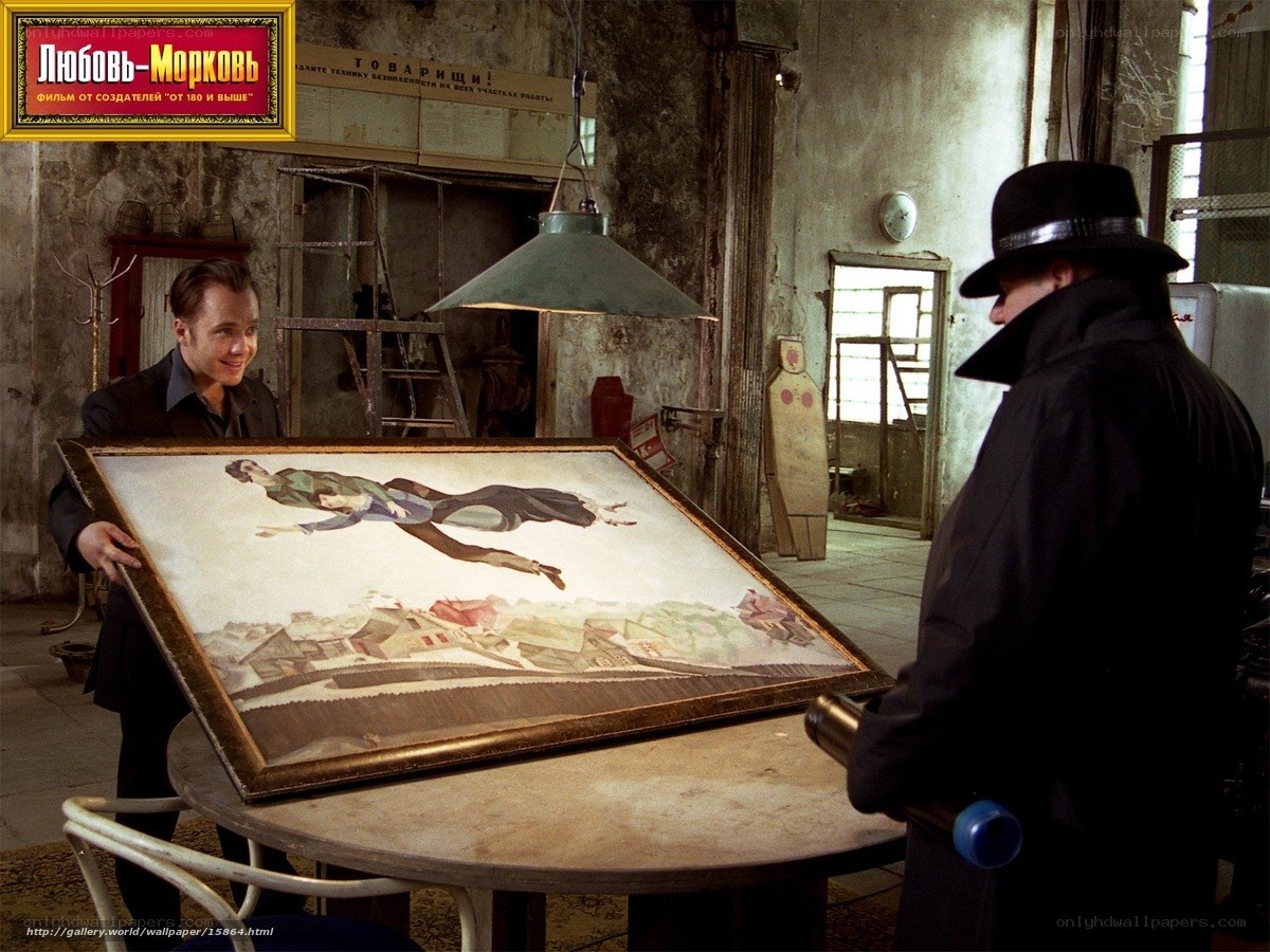 Men with a painting in a workshop