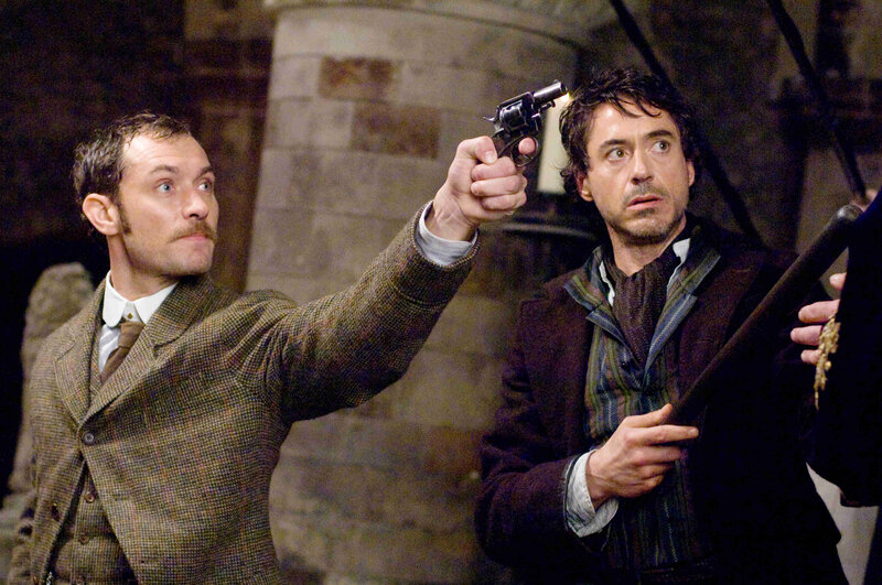 Men with a revolver in a stone room