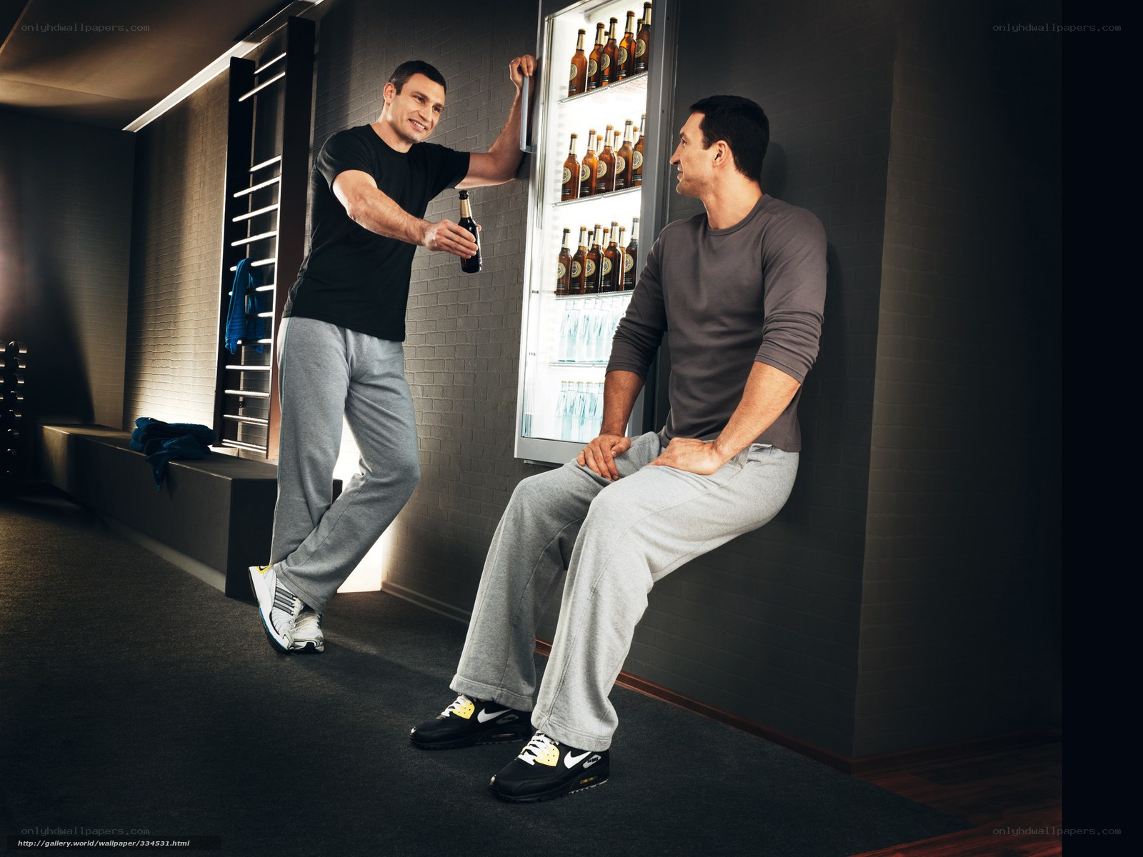 Men with beer in locker room