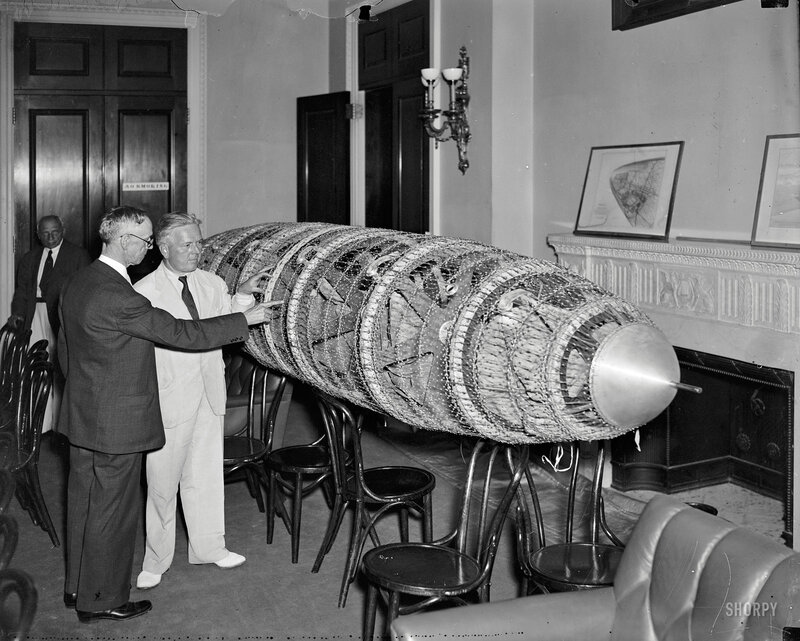 Men with bomb model in room