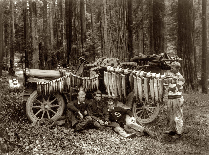 Men with fish haul in forest