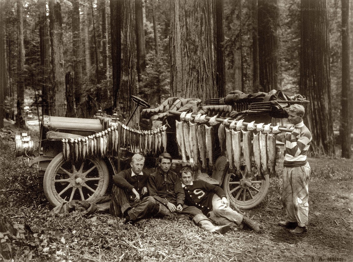 Men with fish haul in forest