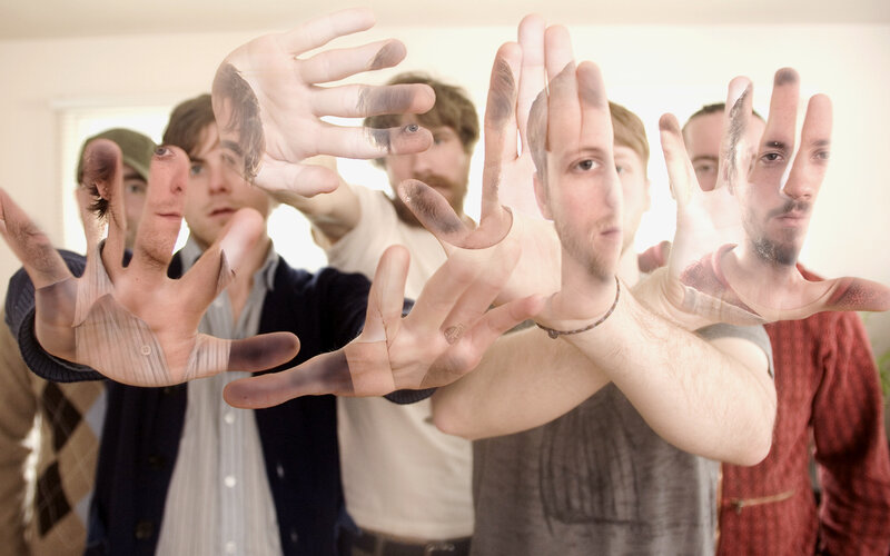 men with hands in front