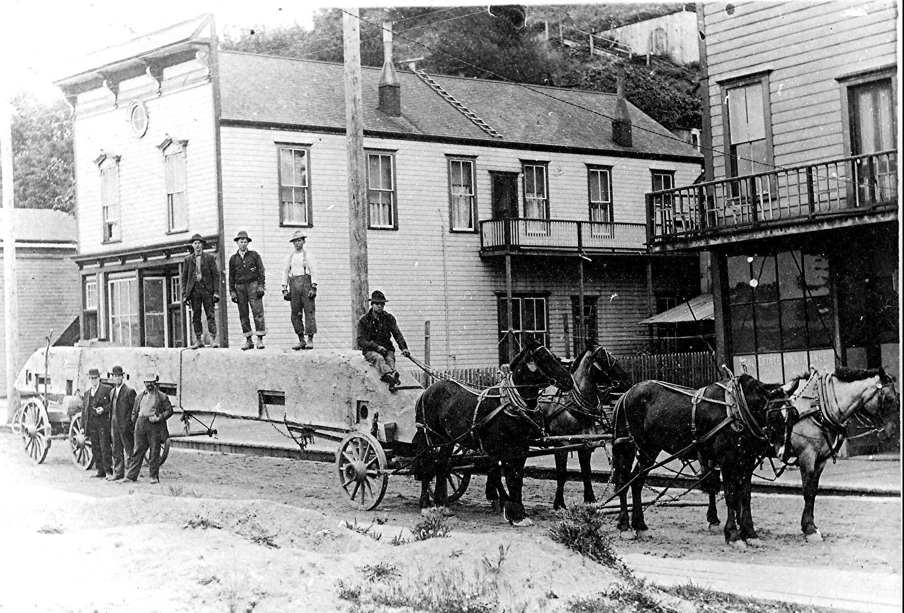 Men with horse-drawn carriage