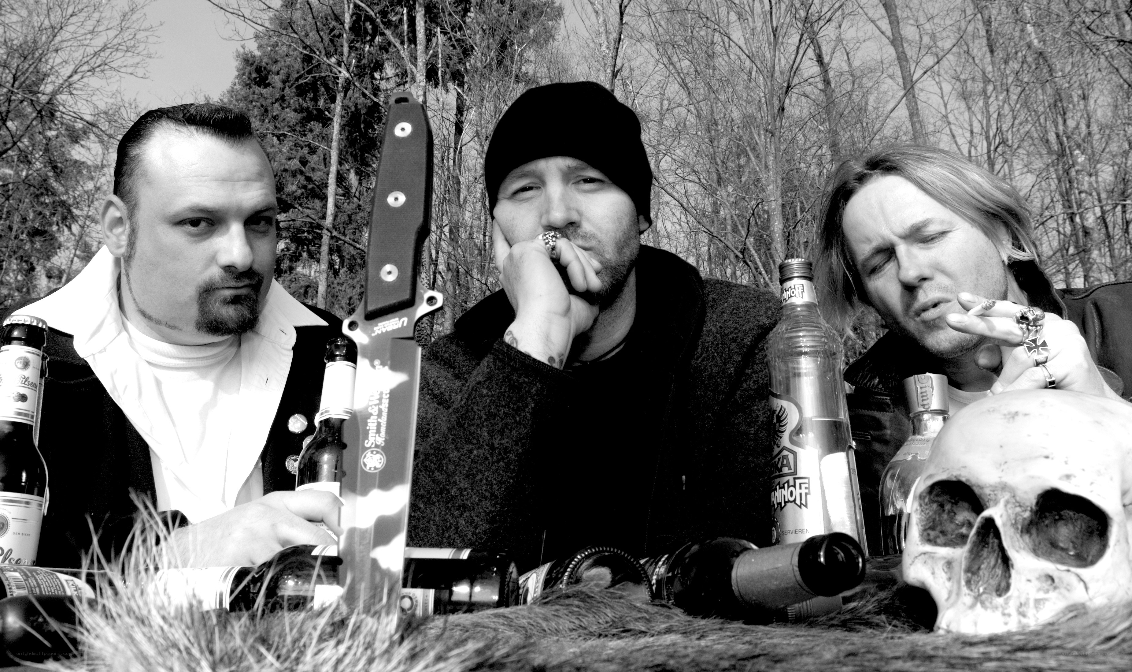 Men with knives and a skull