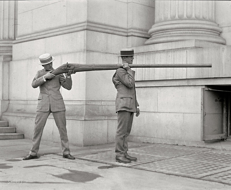 Men with large rifle prop