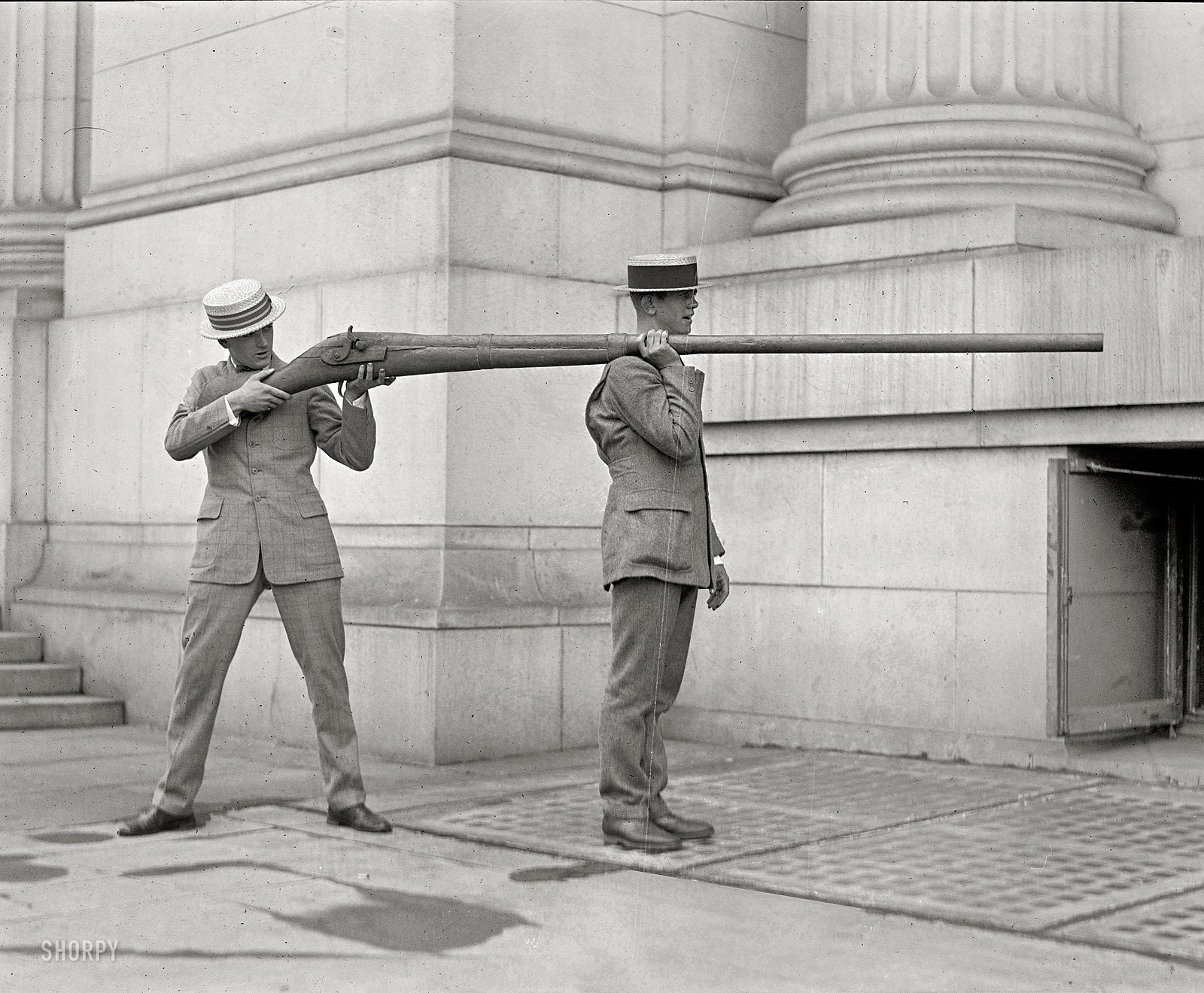 Men with large rifle prop