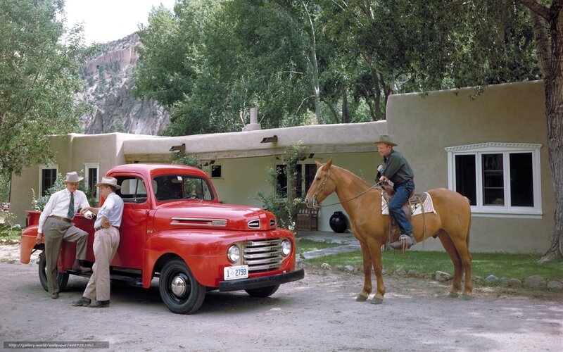 Men with red truck and horse