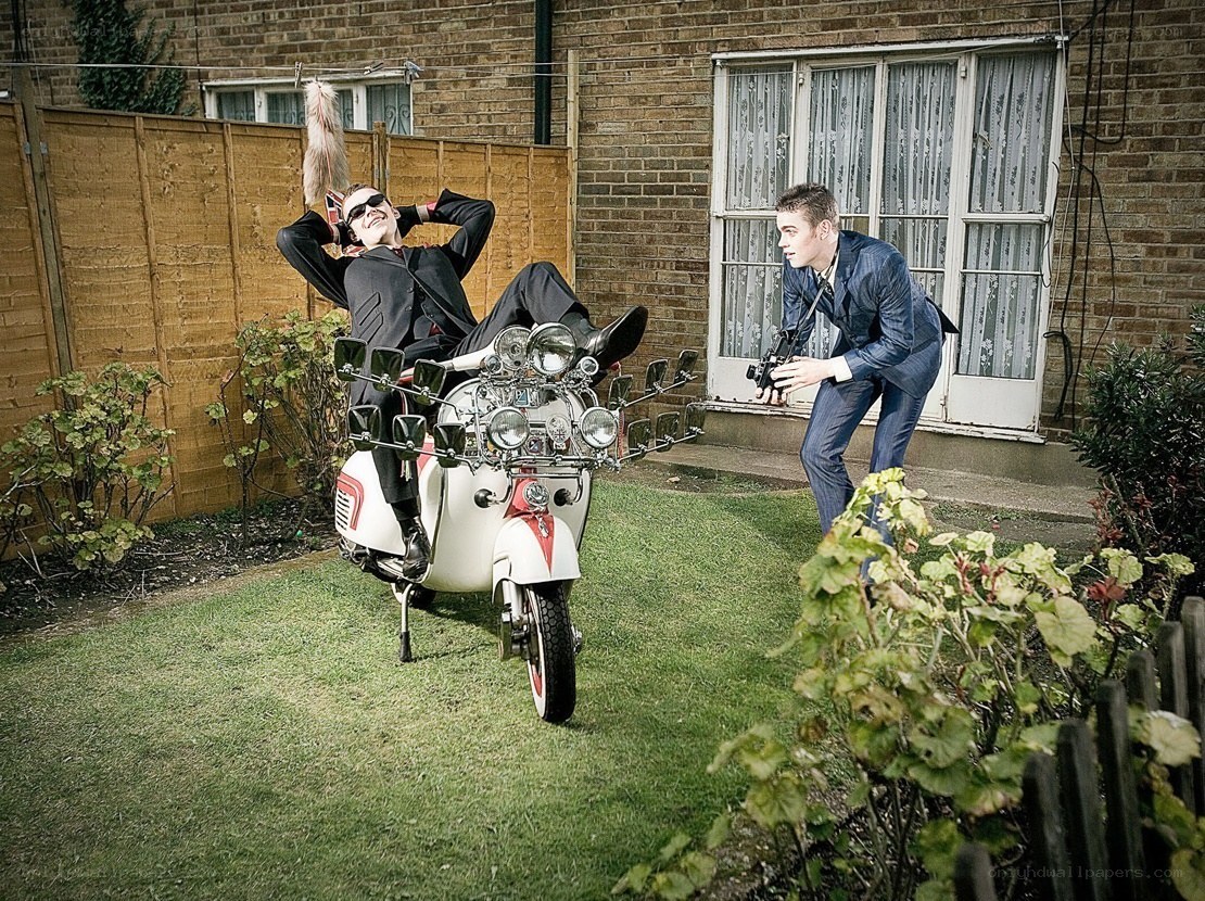 Men with scooter in garden
